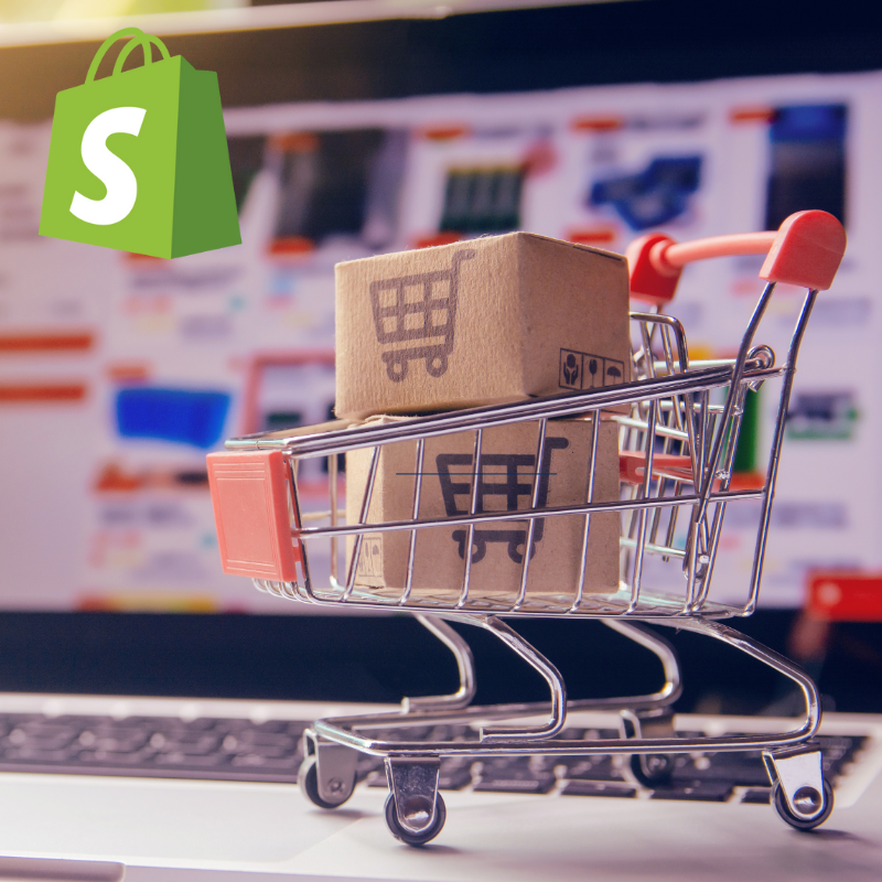 An Image with cart filled with delivery boxes, on the top left corner is logo of shopify